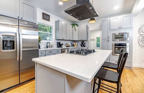 Mickleton Casa | Embrace the charm of our creekside haven featuring 4BR 3BA yoga and BBQ deck.