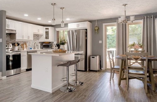 Columbus Casa | Newly remodeled home, spacious deck w/ string lights, & large yard with firepit