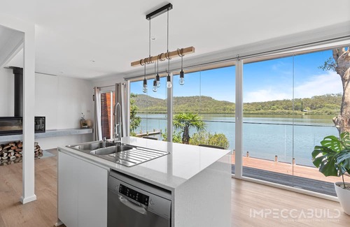 Central Coast Council Casa | Discover Your Riverside Retreat: Modern Comforts, Private Jetty, & Scenic Views!