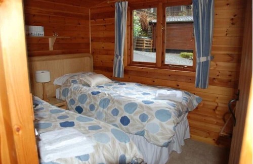 Skelwith Bridge Cabina | Moss Eccles Tarn - Cosy lodge in woodland setting. Pet Friendly.