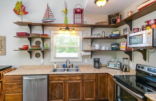 Crane Hill Cabaña | Lakeside cottage with plenty of room . Multiple decks with easy access to water.