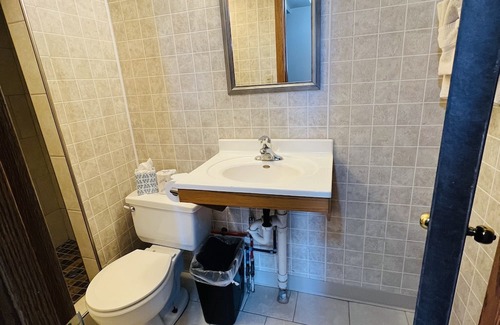 Onalaska Casa | Overlooking Lake Onalaska -- Queen bed + bathroom in nostalgic motel
