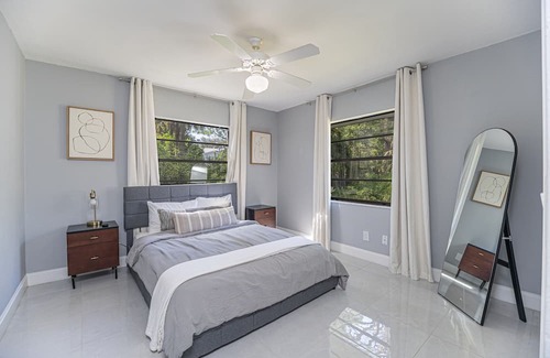 Palm River Estates Casa | Gorgeous Naples home with open-concept layout, sunroom, enclosed pool, & AC