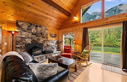 Baring Cabina | Delightful river front cabin with new hot tub and mountain views.