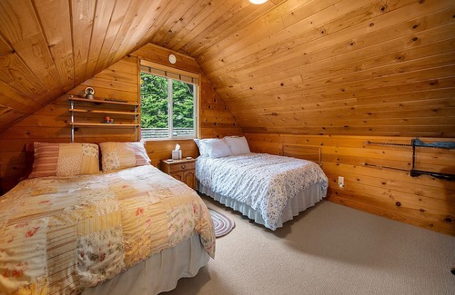 Baring Cabina | Delightful river front cabin with new hot tub and mountain views.