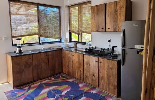 Bwejuu Beach Apartamento | SAND BEACH PALM RESIDENCE