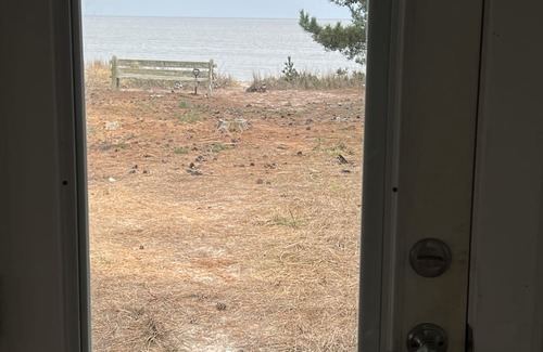 Slaughter Beach Casa | Beachfront Cottage with detached screened porch with stunning beach views.