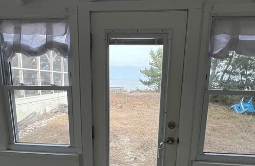 Slaughter Beach Casa | Beachfront Cottage with detached screened porch with stunning beach views.