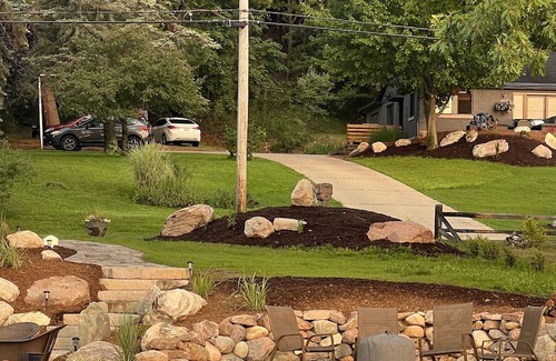 Rapid City Casa | 50 feet of Torch Lake frontage! Boathouse, beautiful patios sweet little beach.