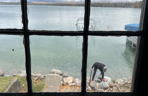 Rapid City Casa | 50 feet of Torch Lake frontage! Boathouse, beautiful patios sweet little beach.
