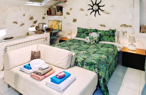 Latte Apartamento | With a fantastic view of the sea and the coast, this cozy vacation apartment welcomes you to a green