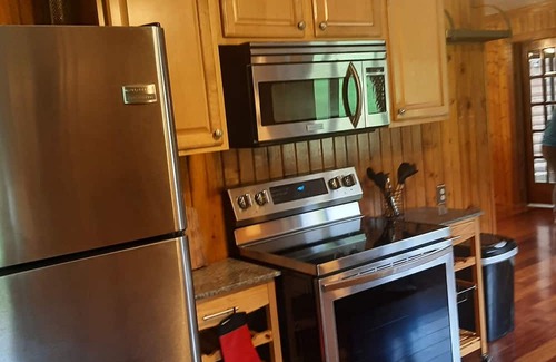Elkton Otro | Log cabin style duplex on 150 acres of beautifully serene wooded farmland