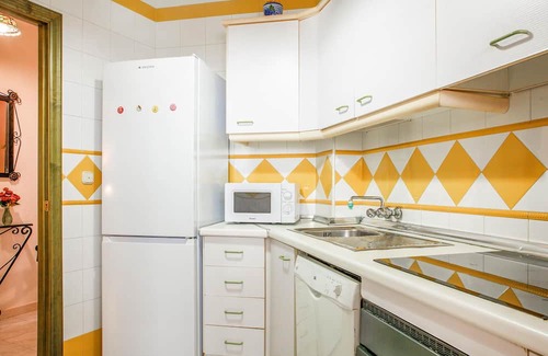 El Portil Apartamento | Enjoy a relaxing vacation in this inviting vacation home with a community pool.