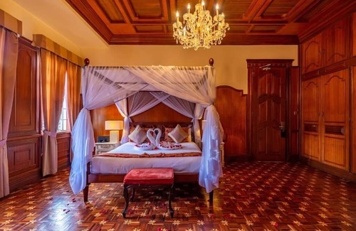 Limuru Hotel | Scenic Escape: Elegant Room Overlooking Lush Grounds