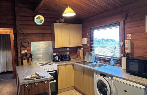 Sandyhills Cabina | Genuine log cabin, Solway Coast. Sleeps 6. Pet friendly. Perfect getaway.