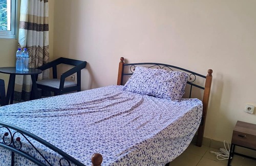 Limete Casa | Cozy Guest Room in Kinshasa with Balcony and Partial Air-Conditioning