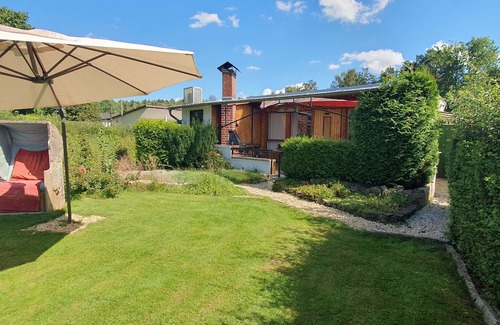Wernsdorf Casa | Tiny house with outdoor chimney and an own water jetty at the lakeside.