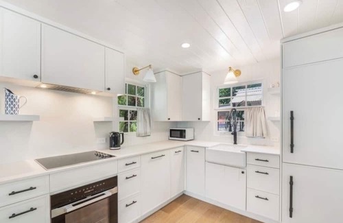 West Bay Cabaña | Historic Boggy Sand Wood Cottage with Pool & Private Seven Mile Beach Access
