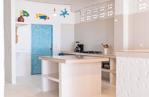 Rincon Apartamento | Spacious beachfront house in Rincón del Mar, white, comfortable, fresh and bright.