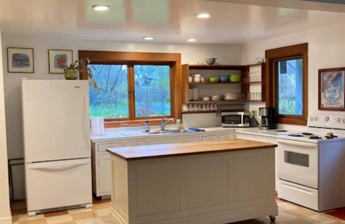 Eastsound Casa | Dragonfly Pond house is a rustic, spacious, light-filled vacation rental home on Orcas Island with high ceilings overlooking a tranquil pond. Clean & comfy. Located in 7 acres of forest, it's peaceful and secluded. Close to town and the ferry.