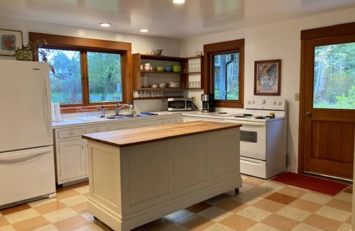Eastsound Casa | Dragonfly Pond house is a rustic, spacious, light-filled vacation rental home on Orcas Island with high ceilings overlooking a tranquil pond. Clean & comfy. Located in 7 acres of forest, it's peaceful and secluded. Close to town and the ferry.