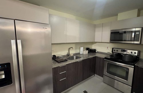 Arouca Condominio | Vive Luxe Condo , Pool & 24/7 Security near Airport