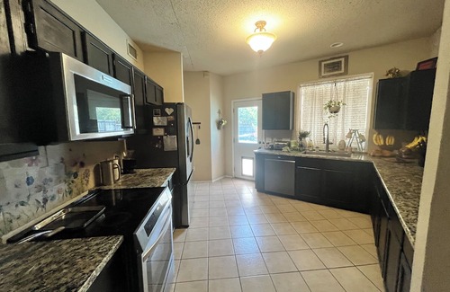 Rowlett Casa | Quiet guest room with WiFi, weightroom, and outdoor area.