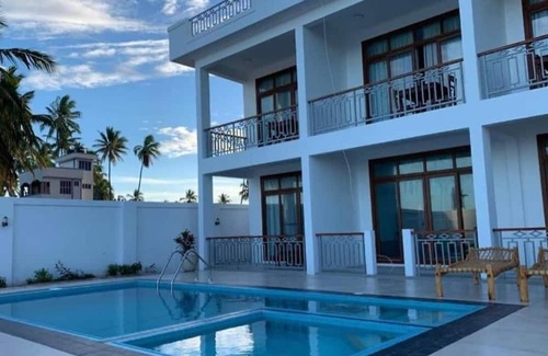 Pwani Mchangani Villa | Villa Blue Fish It's is Beach Front Villa with Swimming Pool suitable for famil