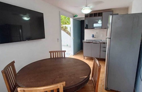 Armacao Apartamento | One bedroom and living room apartment with fully equipped kitchen.