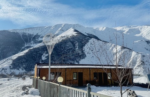 Kazbegi Apartamento | A studio apartment at a secluded area by the river, surrounded by mountains.
