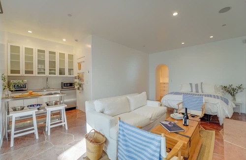 Middletown Cabaña | MONTHLY Santorini-inspired Walk-out Cottage w/Private Patio, Fireplace + Jacuzzi