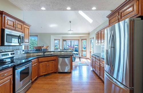 Carter Lake Casa | 5 bed 3 miles to downtown Omaha and CWS. Hot Tub, Pool Table & Dart Board