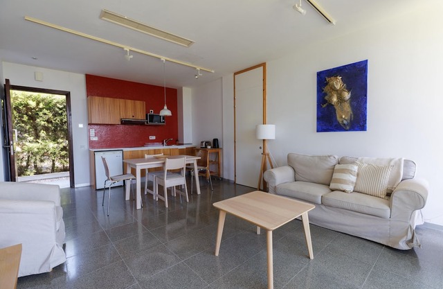 Eucrasia | One-Bedroom Apartment, Art by PraXis Apartments