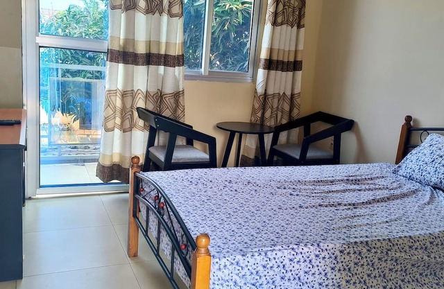 Cozy Guest Room in Kinshasa with Balcony and Partial Air-Conditioning