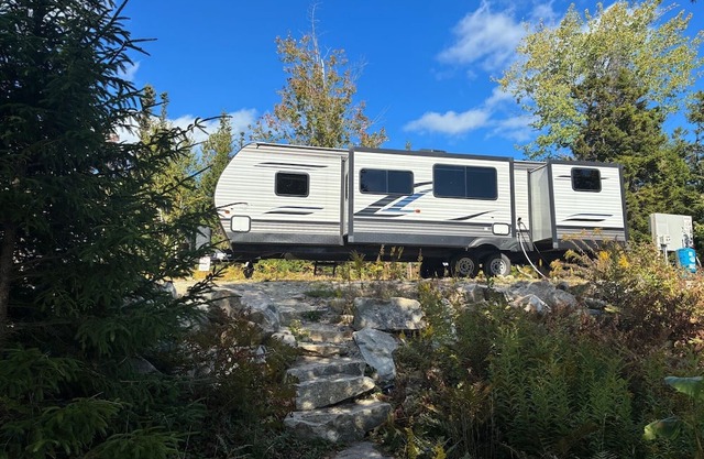 Starlight Beach Experience 31' RV Travel Trailer on private beach and firepit