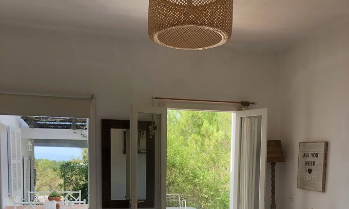 Es Cap de Barbaria Casa | Formentera. Room immersed in the woods with sea view.
