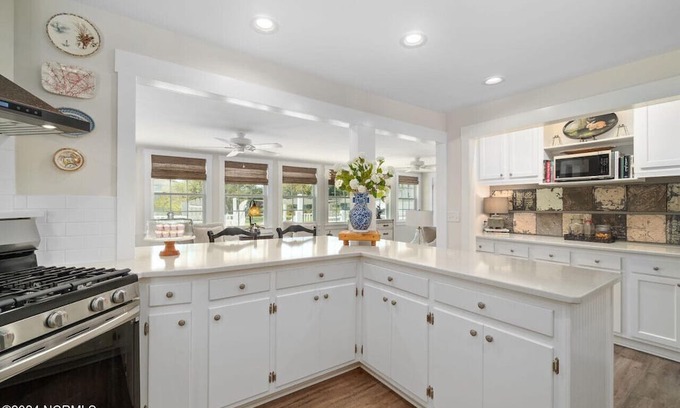 Cedar Point Casa | Luxury at the Water, enjoy the bikes, kayaks, volleyball, and shared dock that is a short walk away.