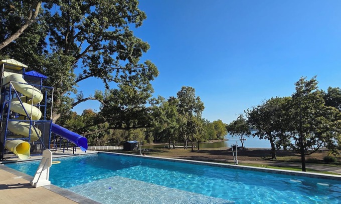 Grove Casa | Giant10-bedroom lakefront home with large pool, hot tub, and dock