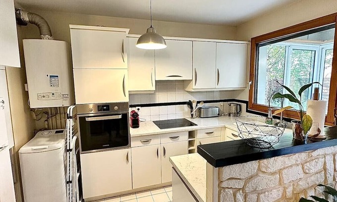 Les Aunettes Apartamento | Cosy apartment with garden and parking, close to Paris
