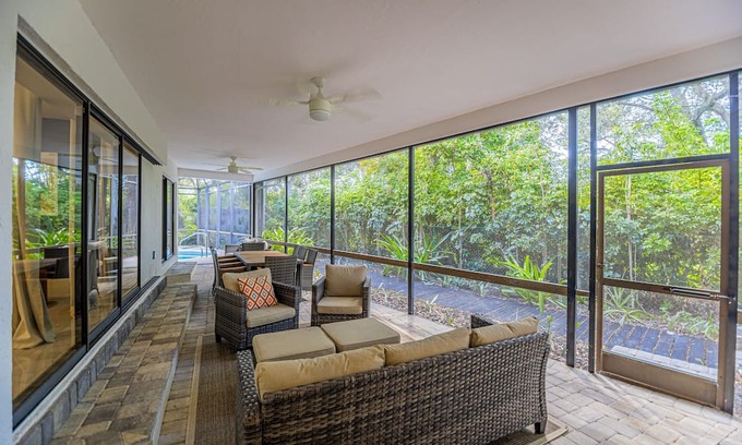 Palm River Estates Casa | Gorgeous Naples home with open-concept layout, sunroom, enclosed pool, & AC