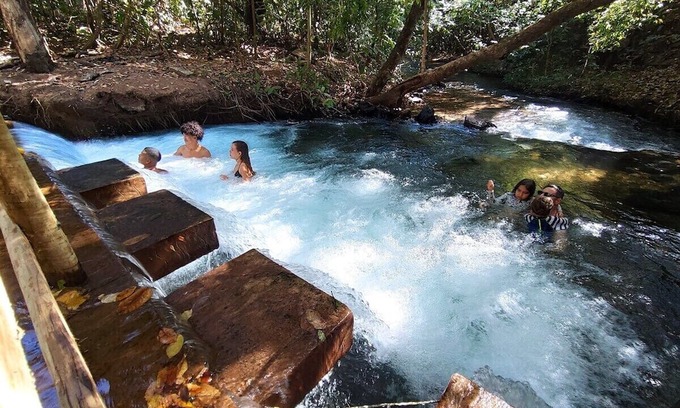 Pousada do Rio Quente Apartamento | Resort Park Veredas with the warm river in the background