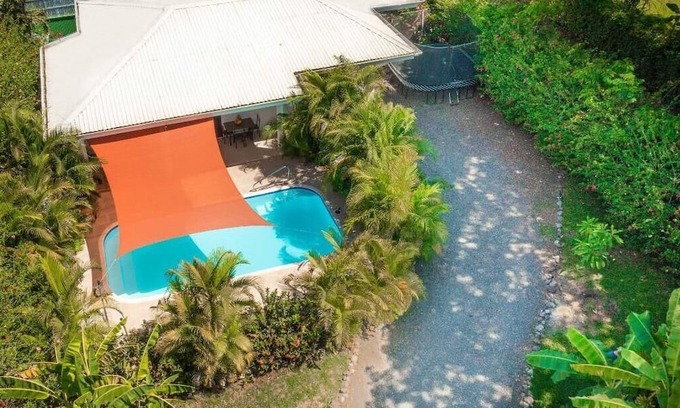 Puntarenas Casa | Macaws over head, monkeys in the distance, nature surrounding the pool…Pura Vida