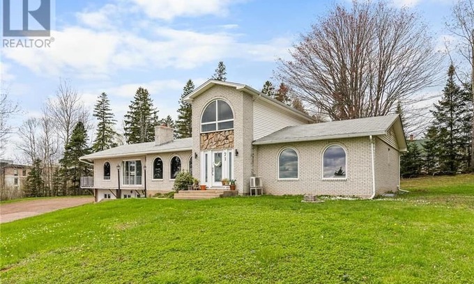 Moncton Villa | Modern Designer Villa Condo in Prime Location with Exclusive Amenities".