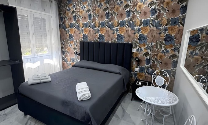 Monte Po-Nesima-San Leone-Rapisardi Apartamento | Room 'Dolce Relax - Tripla Luxury' with Wi-Fi and Air Conditioning