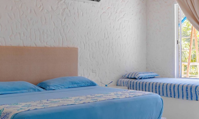 Rincon Apartamento | Spacious beachfront house in Rincón del Mar, white, comfortable, fresh and bright.