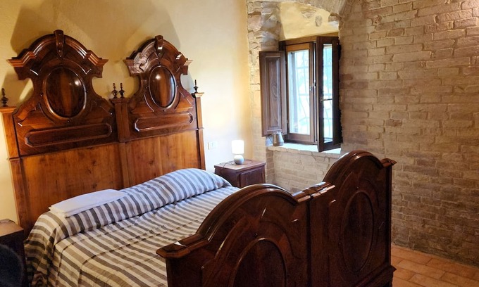 Cagli Casa | Cà Paradiso - Room '800 private bath, sitting area, fireplace and kitchen shared