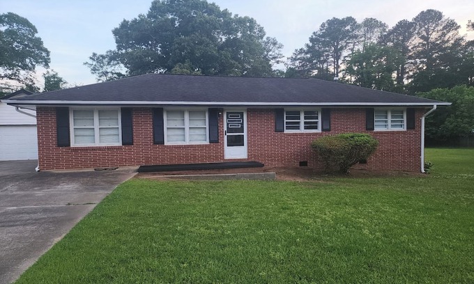 Covington Casa | Charming brick ranch on 1.28 acres near downtown Covington, GA,